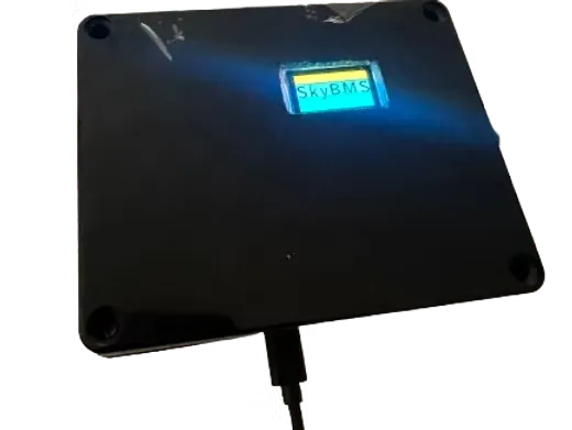 Sky BMS top view — SkyBMS logo displayed on OLED screen
